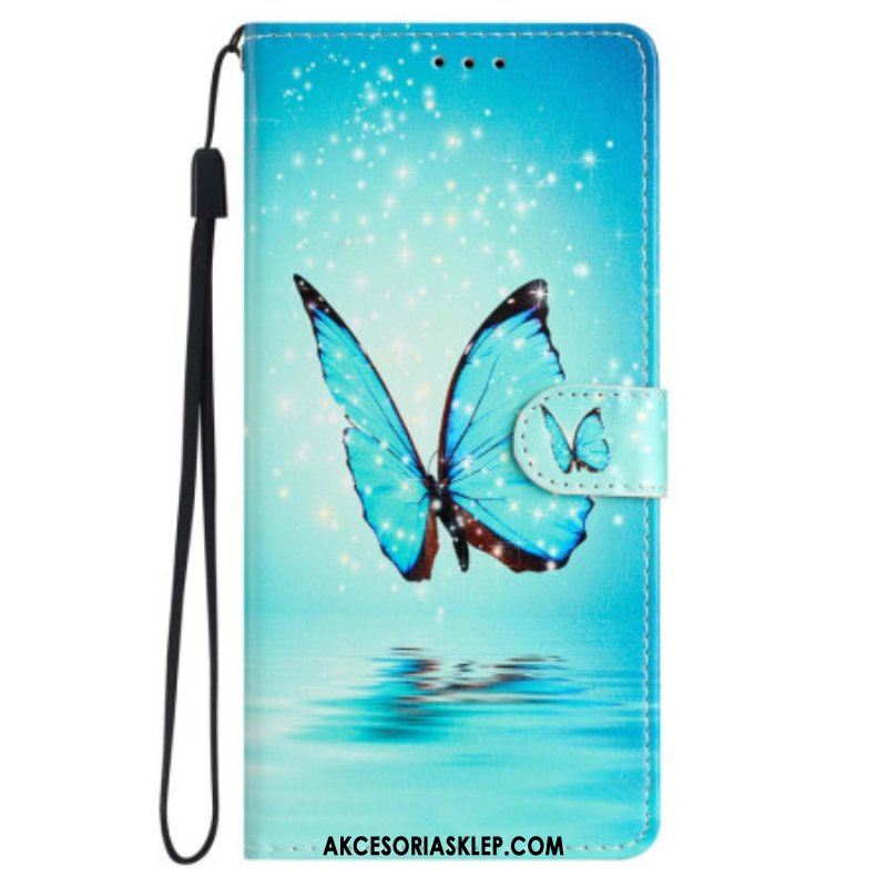 Etui Folio do iPhone 15 z Łańcuch Niebieski Motyl W Locie Z Paskiem